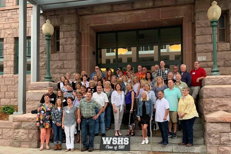 WHS Class of 1981 gathered on the front steps for a group reunion photo